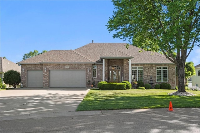 15471 Cedar Ln, Basehor, KS 66007 - view of front facade featuring a garage, concrete driveway, a front yard, brick siding, and a shingled roof