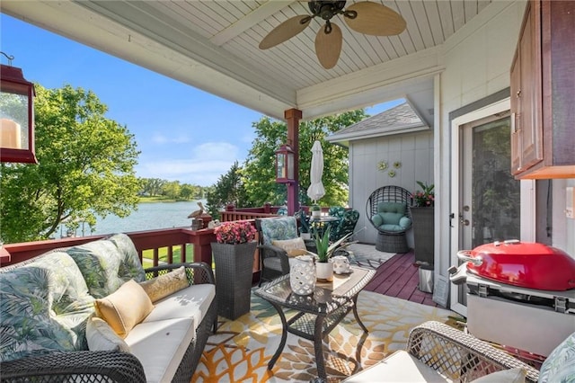 15471 Cedar Ln, Basehor, KS 66007 - wooden terrace with an outdoor living space, a water view, a ceiling fan, and grilling area