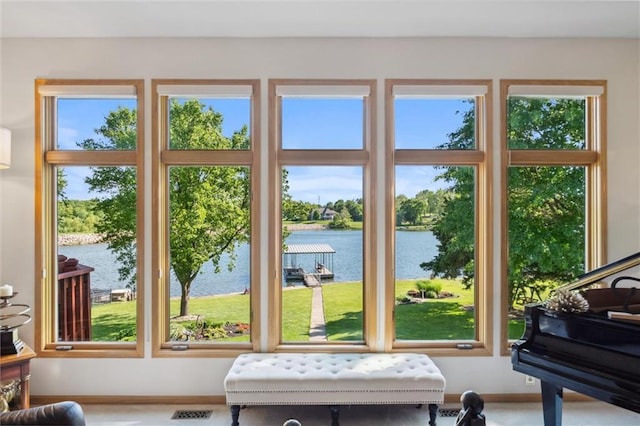 15471 Cedar Ln, Basehor, KS 66007 - doorway to outside featuring a water view, plenty of natural light, and baseboards