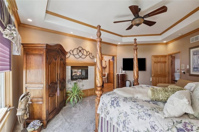 15471 Cedar Ln, Basehor, KS 66007 - bedroom featuring a raised ceiling, ornamental molding, light colored carpet, recessed lighting, and multiple windows