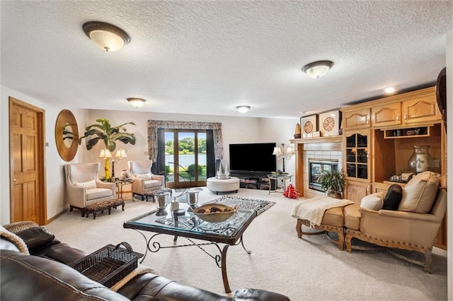 15471 Cedar Ln, Basehor, KS 66007 - living room featuring carpet flooring, a textured ceiling, and a tile fireplace