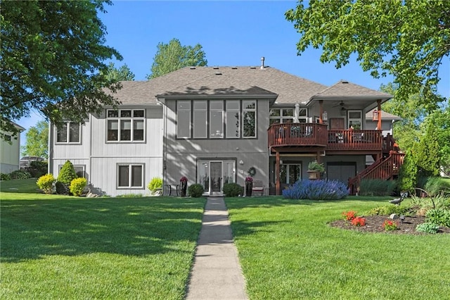 15471 Cedar Ln, Basehor, KS 66007 - back of house featuring ceiling fan, a deck, a lawn, a shingled roof, and stairs