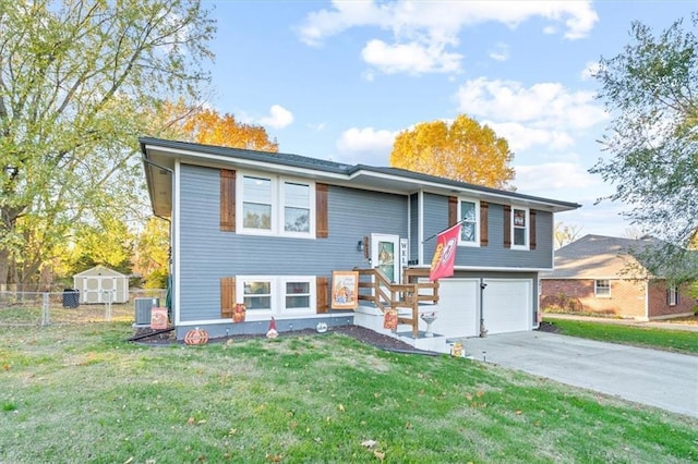 3620 S Northern Blvd, Independence, MO 64052 - view of front facade featuring a garage, driveway, and central AC unit