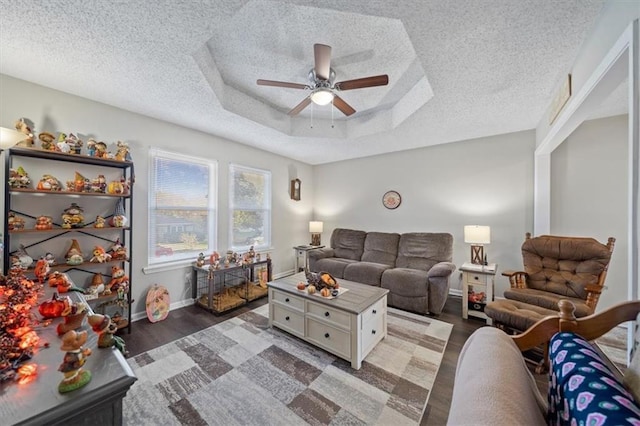 3620 S Northern Blvd, Independence, MO 64052 - living room with ceiling fan, a textured ceiling, light wood-style flooring, a raised ceiling, and baseboards