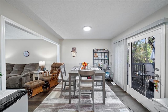 3620 S Northern Blvd, Independence, MO 64052 - dining space featuring dark wood finished floors and a textured ceiling
