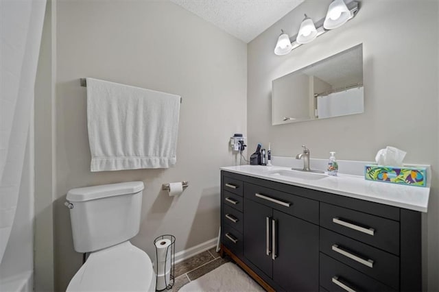 3620 S Northern Blvd, Independence, MO 64052 - full bathroom featuring vanity, toilet, baseboards, a textured ceiling, and a shower with curtain