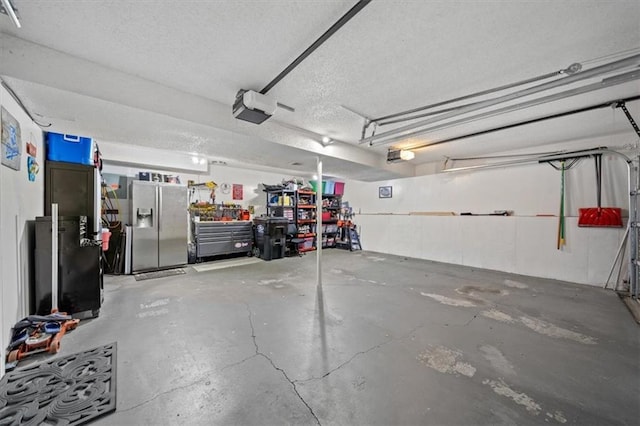 3620 S Northern Blvd, Independence, MO 64052 - garage featuring stainless steel refrigerator with ice dispenser and a garage door opener