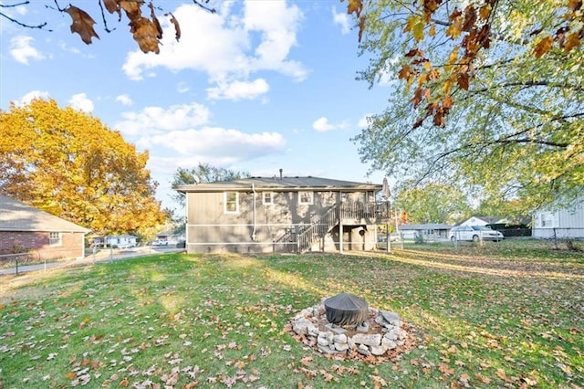 3620 S Northern Blvd, Independence, MO 64052 - back of property featuring an outdoor fire pit, a deck, and stairway