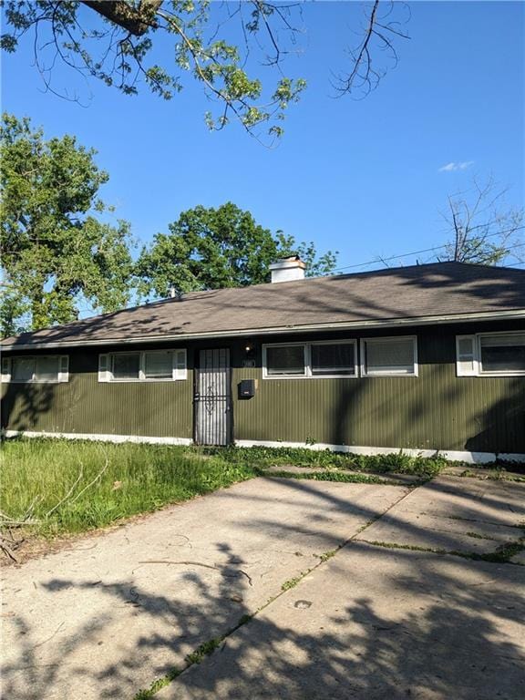 11001 Bristol Ter, Kansas City, MO 66134 - view of front of home with a chimney
