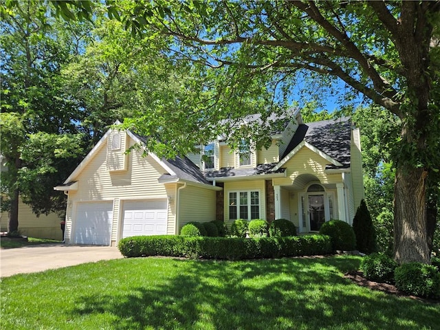503 Quail Trl, Warrensburg, MO 64093 - traditional home featuring a chimney, an attached garage, a front lawn, and driveway
