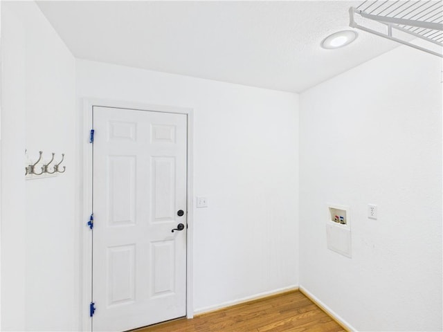 503 Quail Trl, Warrensburg, MO 64093 - laundry area with hookup for a washing machine and light wood-style flooring