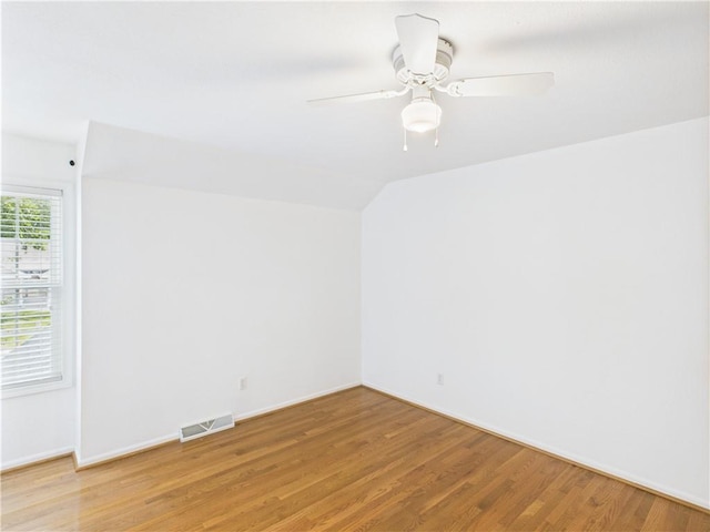 503 Quail Trl, Warrensburg, MO 64093 - spare room with light wood-style flooring, lofted ceiling, and a ceiling fan