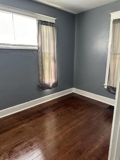1331 S 17th St, Saint Joseph, MO 64507 - unfurnished room with dark wood-type flooring and baseboards