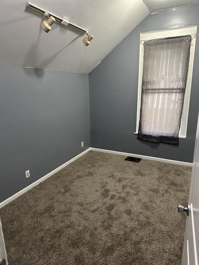 1331 S 17th St, Saint Joseph, MO 64507 - additional living space with lofted ceiling, carpet flooring, and baseboards