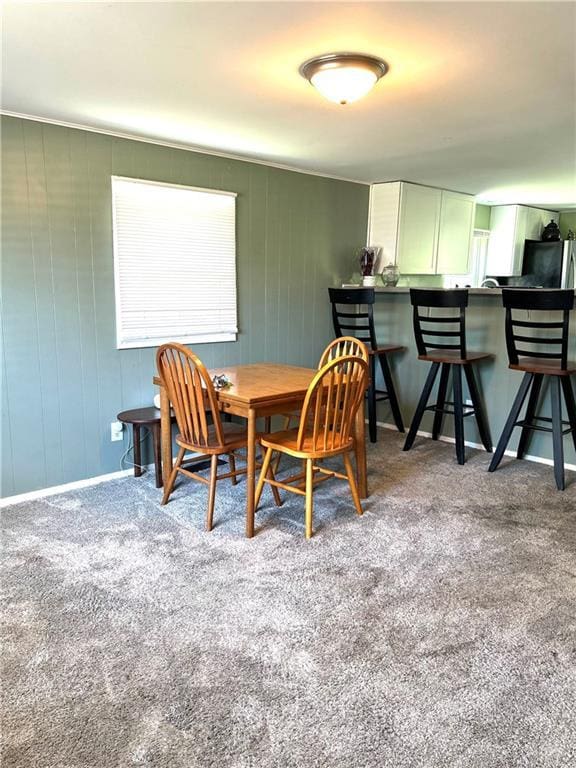 3408 67th St, Kansas City, MO 64119 - carpeted dining room with baseboards