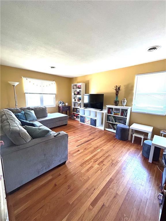 3408 67th St, Kansas City, MO 64119 - living room with wood finished floors