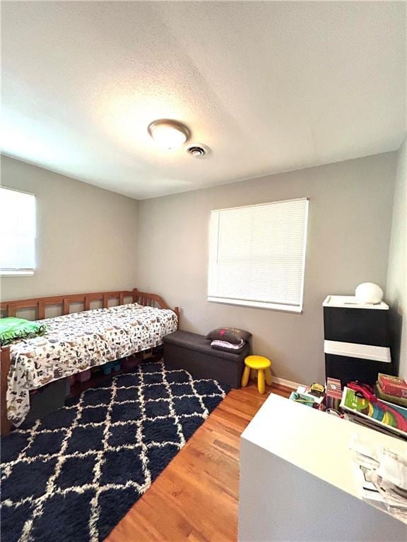 3408 67th St, Kansas City, MO 64119 - bedroom with wood finished floors