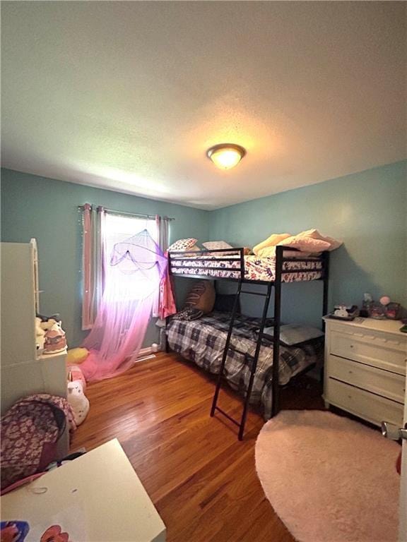 3408 67th St, Kansas City, MO 64119 - bedroom featuring wood finished floors