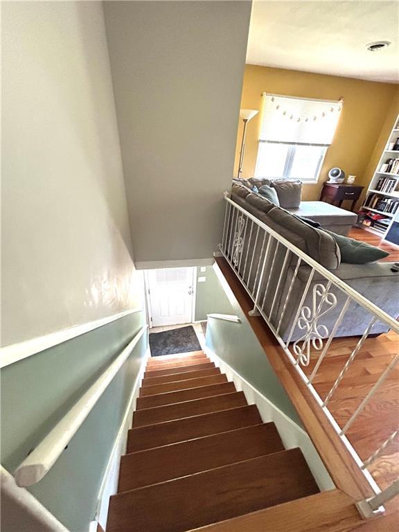 3408 67th St, Kansas City, MO 64119 - stairway with wood finished floors