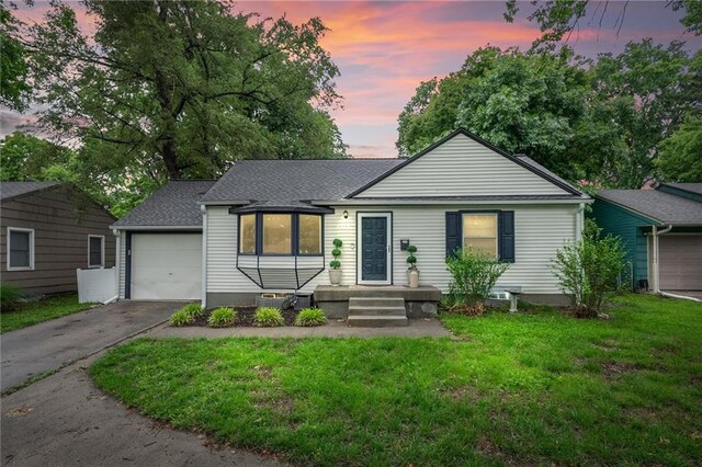 2912 W 75th St, Prairie Village, KS 66208 - single story home with asphalt driveway, a front lawn, an attached garage, and roof with shingles