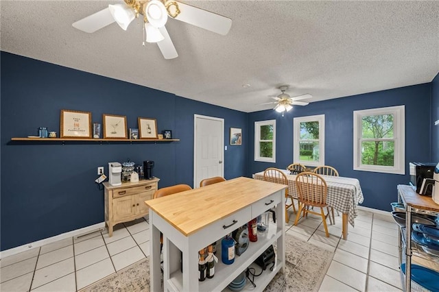 2912 W 75th St, Prairie Village, KS 66208 - dining space featuring a ceiling fan, a textured ceiling, and light tile patterned floors