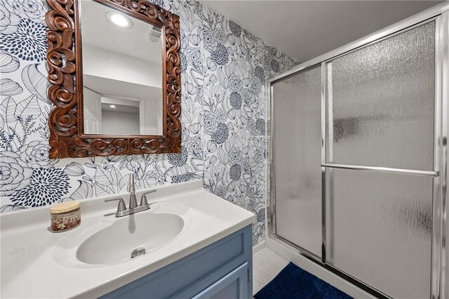 2912 W 75th St, Prairie Village, KS 66208 - full bath featuring wallpapered walls, vanity, and a shower with shower door