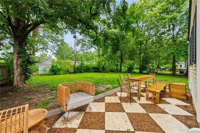 2912 W 75th St, Prairie Village, KS 66208 - view of patio / terrace with outdoor dining area and view of wooded area