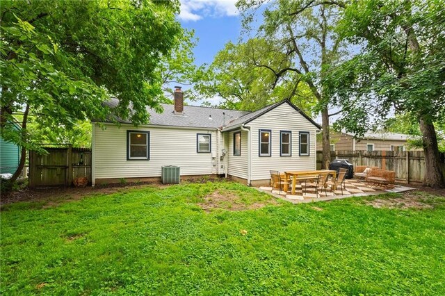 2912 W 75th St, Prairie Village, KS 66208 - back of property featuring a chimney and a patio area