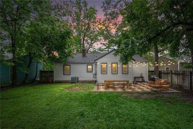 2912 W 75th St, Prairie Village, KS 66208 - rear view of house with a patio, a chimney, and roof with shingles
