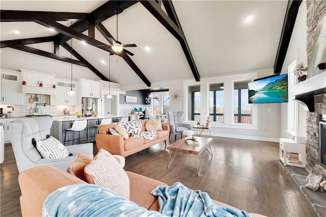 905 SE Wood Ridge Ct, Blue Springs, MO 64014 - living area with a fireplace, beamed ceiling, dark wood-type flooring, a ceiling fan, and high vaulted ceiling