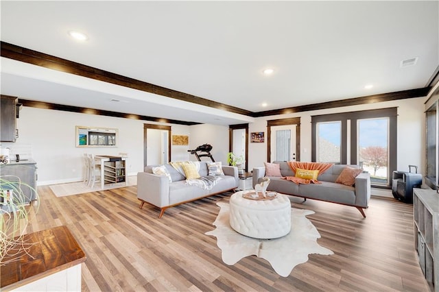 905 SE Wood Ridge Ct, Blue Springs, MO 64014 - living room featuring light wood-style floors, baseboards, crown molding, and recessed lighting