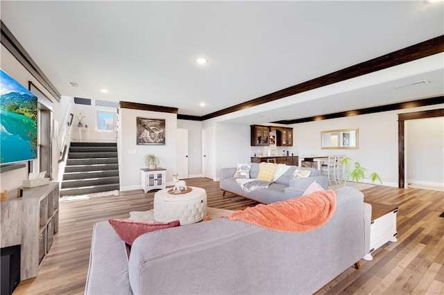 905 SE Wood Ridge Ct, Blue Springs, MO 64014 - living area featuring stairs, baseboards, light wood-style floors, and recessed lighting