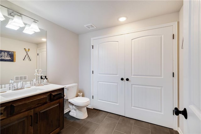 905 SE Wood Ridge Ct, Blue Springs, MO 64014 - bathroom with vanity, toilet, tile patterned floors, and recessed lighting