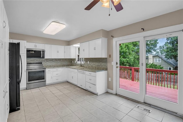 838 E 125th Ter, Olathe, KS 66061 - kitchen with stainless steel appliances, a sink, white cabinets, light tile patterned floors, and a ceiling fan