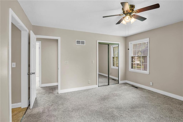 838 E 125th Ter, Olathe, KS 66061 - unfurnished bedroom featuring a closet, carpet, baseboards, and a ceiling fan