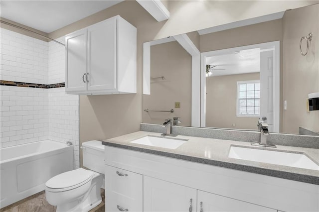838 E 125th Ter, Olathe, KS 66061 - bathroom featuring double vanity, toilet, a ceiling fan, and washtub / shower combination