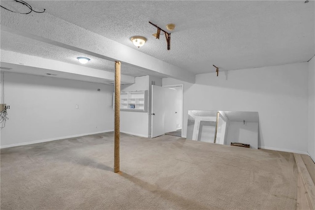 838 E 125th Ter, Olathe, KS 66061 - finished below grade area with a textured ceiling, carpet floors, and baseboards