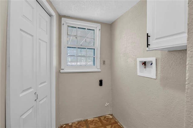 838 E 125th Ter, Olathe, KS 66061 - washroom with cabinet space, a textured wall, a textured ceiling, hookup for a washing machine, and hookup for an electric dryer