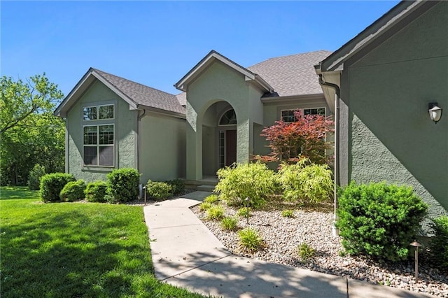 17105 Bo Cir, Tonganoxie, KS 66086 - view of front of home featuring a front yard and stucco siding