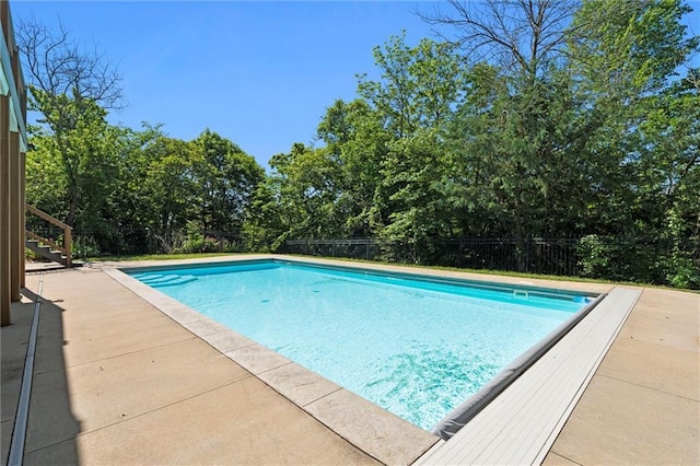 17105 Bo Cir, Tonganoxie, KS 66086 - view of pool featuring view of wooded area, stairway, and a patio area