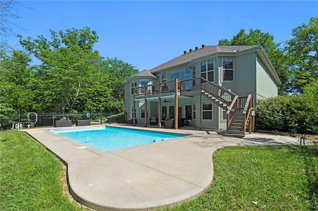 17105 Bo Cir, Tonganoxie, KS 66086 - view of swimming pool with stairway, a ceiling fan, a patio, and an outdoor hangout area