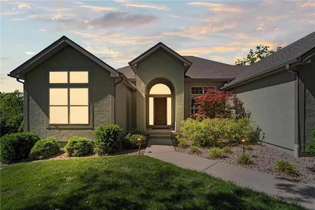17105 Bo Cir, Tonganoxie, KS 66086 - view of front facade featuring stucco siding and a lawn