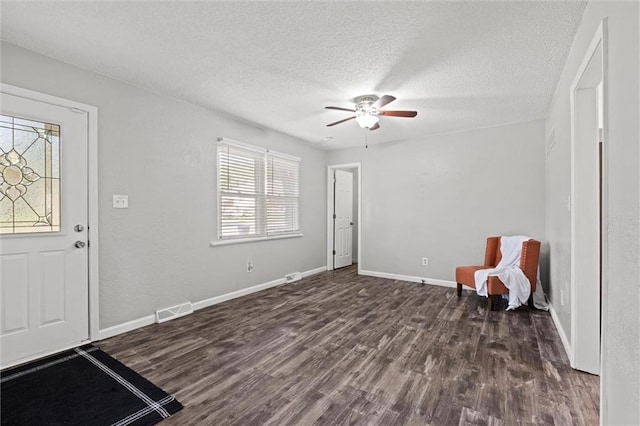 16807 E 3rd Ter N, Independence, MO 64056 - entryway with a ceiling fan, dark wood-style flooring, and a textured ceiling