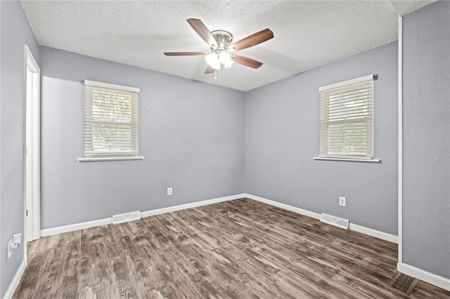 16807 E 3rd Ter N, Independence, MO 64056 - unfurnished room featuring wood finished floors, a ceiling fan, and a textured ceiling