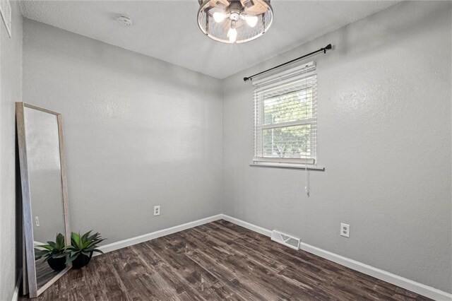 16807 E 3rd Ter N, Independence, MO 64056 - spare room with a smoke detector and dark wood finished floors