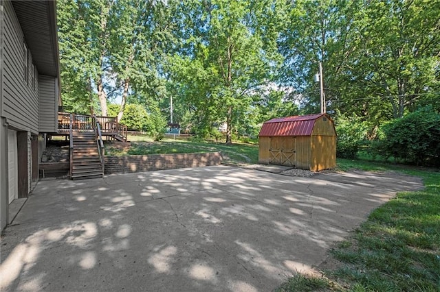16807 E 3rd Ter N, Independence, MO 64056 - view of patio featuring a storage shed, stairway, a wooden deck, and view of scattered trees