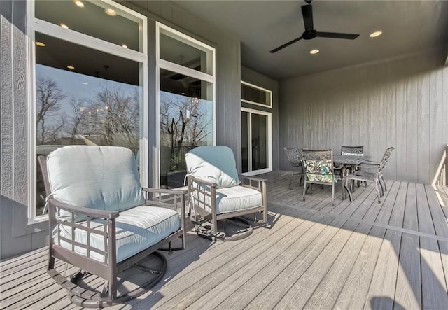 8013 Payne St, Shawnee, KS 66220 - wooden terrace with ceiling fan and outdoor dining space