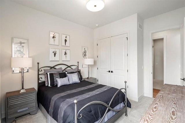 8013 Payne St, Shawnee, KS 66220 - bedroom featuring light carpet, a closet, and baseboards
