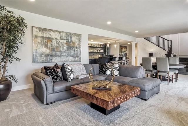 8013 Payne St, Shawnee, KS 66220 - carpeted living room with stairway, baseboards, recessed lighting, and bar