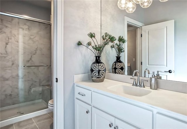 8013 Payne St, Shawnee, KS 66220 - full bath featuring a shower stall, vanity, toilet, and tile patterned flooring
